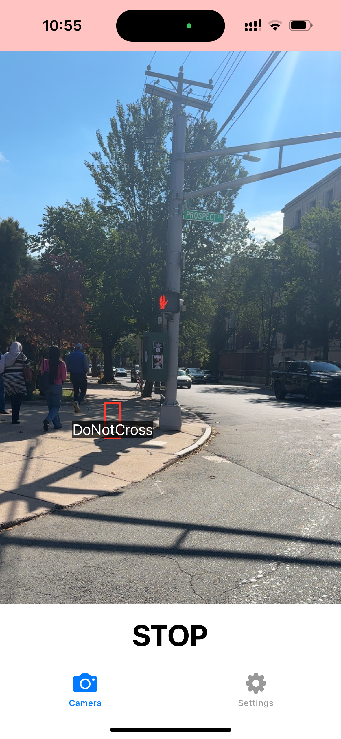 Figure 6: Screenshot of the ClearCross app in use and identifying a "DoNotWalk" crosswalk signal at Elm and College Street in New Haven, Connecticut. The app displays bounding boxes and classifcations for the crosswalk signal detected.
